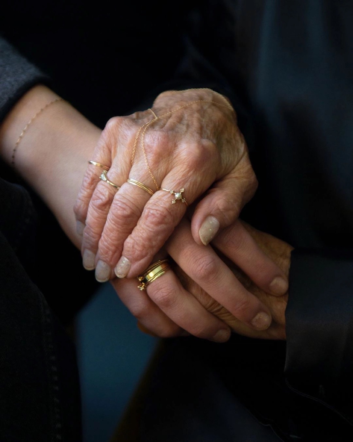 Hands held close, generations connected